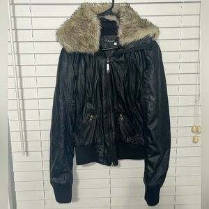 Faux leather women’s black jacket with faux fur. Has 2 pockets w/ zipper. Zipper